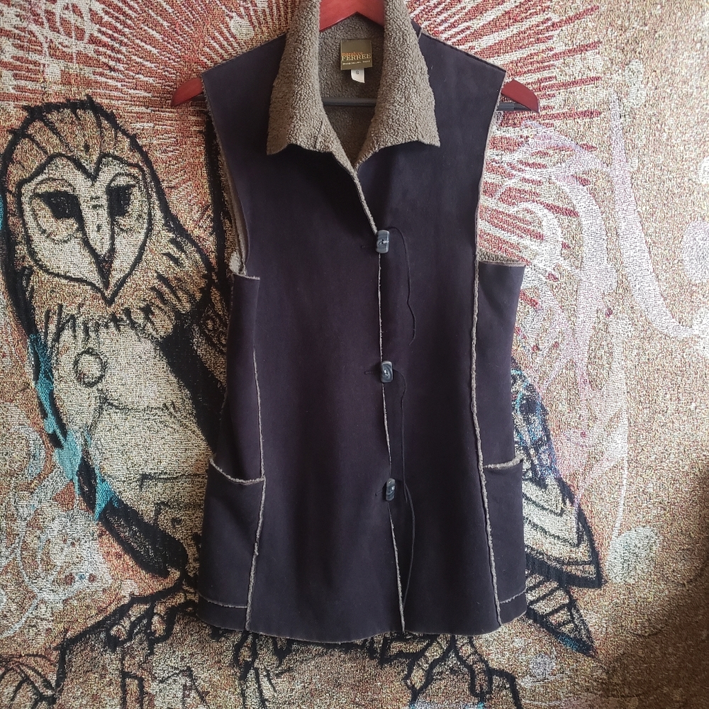 Microsuede, fleece lined shearling style vest.